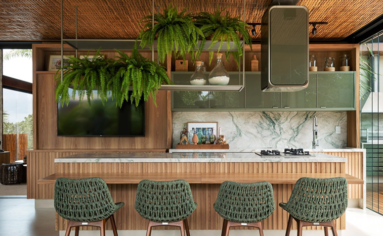 área gourmet com TV integrada e iluminação aconchegante para assistir aos jogos em casa